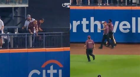 mets fan falls onto field|mets fan falls out of stands.